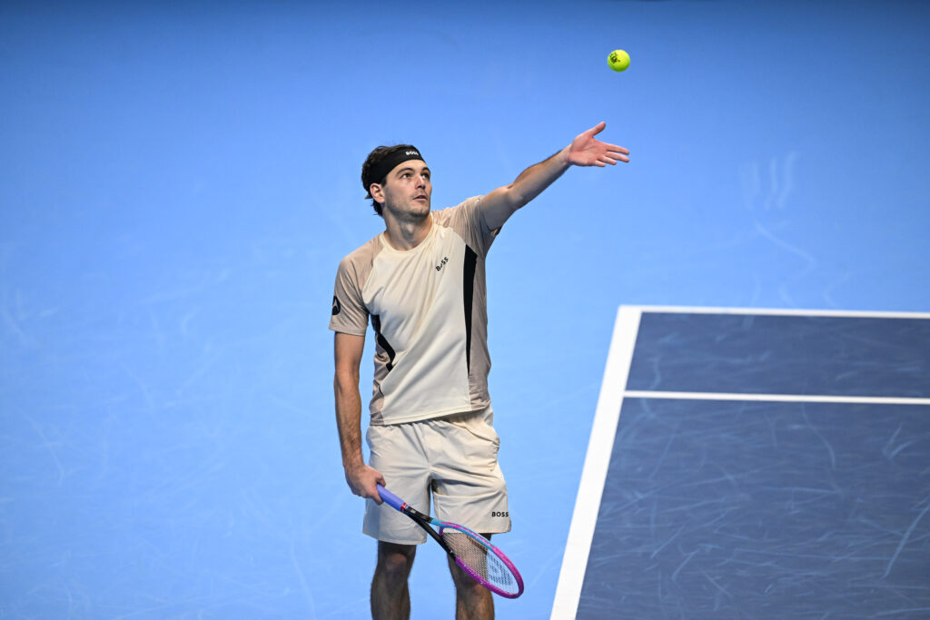 Taylor Fritz of the United States in action against Lorenzo Musetti of Italy during the Group Stage match on day two of the Nitto ATP Finals 2025.