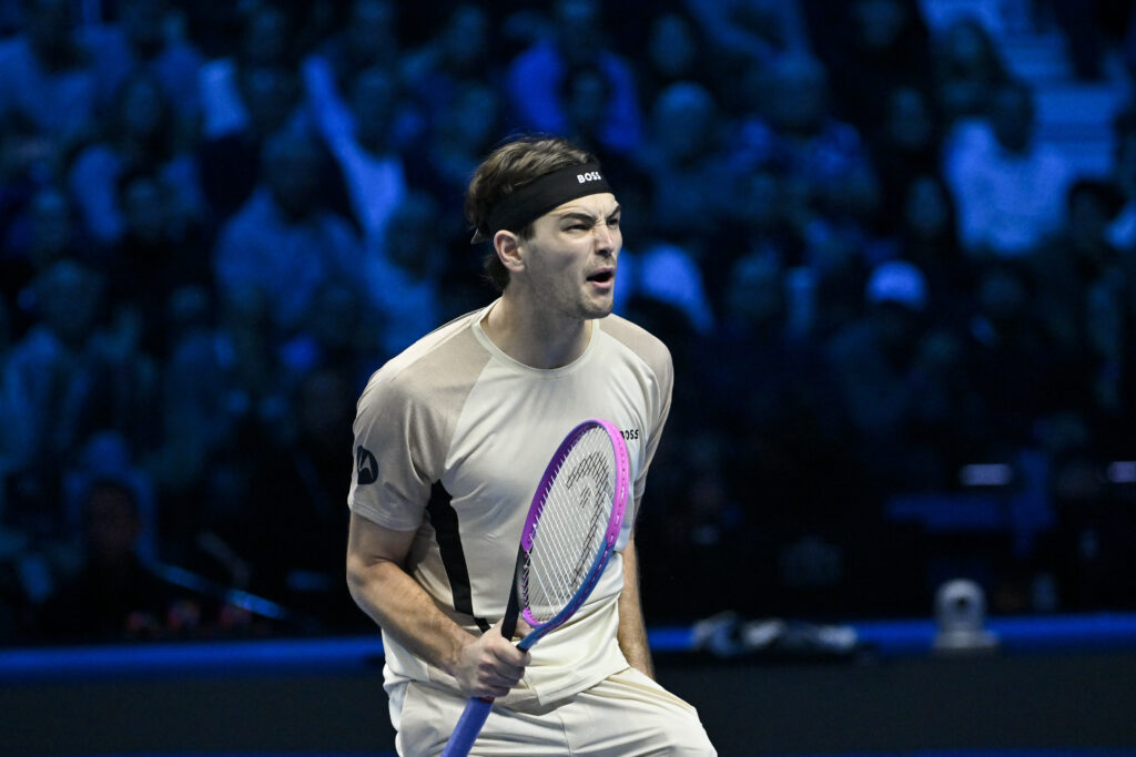 Taylor Fritz of the United States celebrates a score against Lorenzo Musetti of Italy during the Group court match on day two of the Nitto ATP Finals 2025 at Inalpi Arena on November 10, 2025.