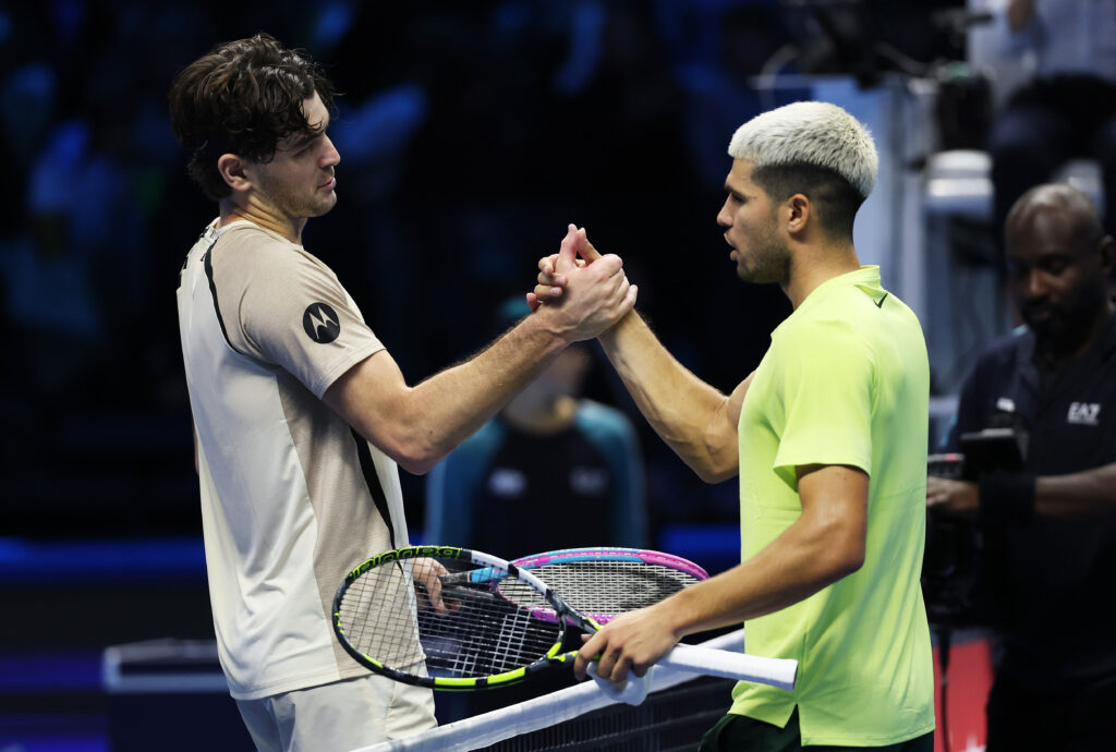 Carlos Alcaraz of Spain shakes hands with Taylor Fritz of United States following their Men’s Singles Group Stage match on day three of the Nitto ATP Finals 2025 at Inalpi Arena on November 11, 2025 in Turin, Italy.