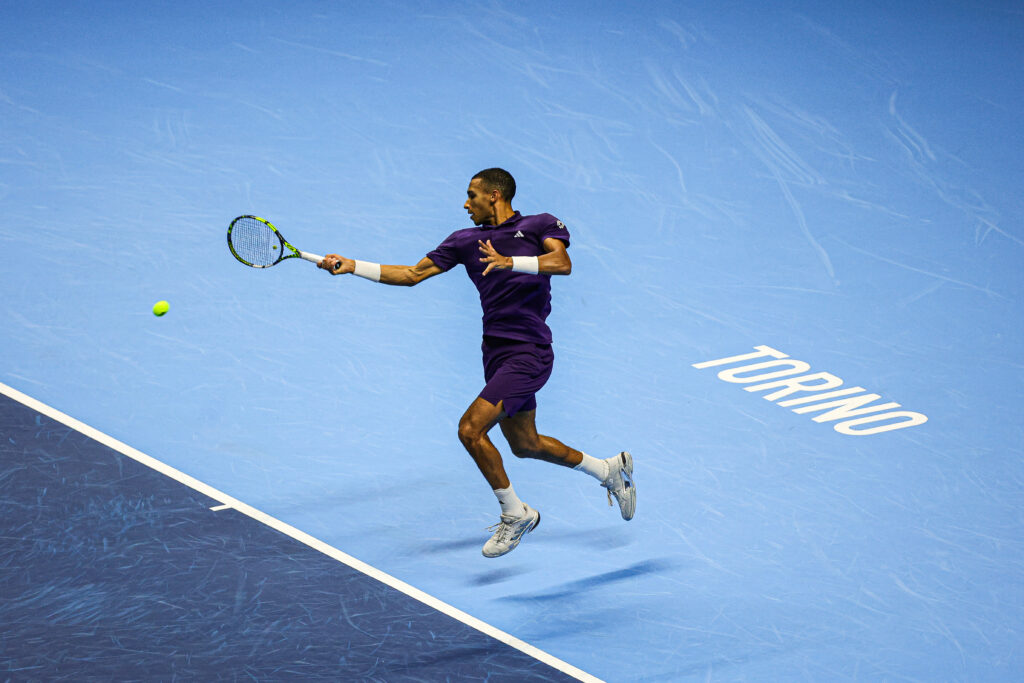 Felix Auger-Aliassime of Canada plays in the Men's Singles Round match against Carlos Alcaraz of Spain during day seven of the Nitto ATP Finals 2025 at Inalpi Arena in Turin, Italy, on November 15, 2025.
