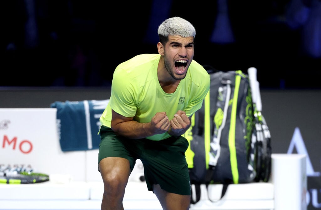 Carlos Alcaraz of Spain celebrates victory and ending the year in the Number 1 ATP Ranking spot during the Men’s Singles Group Stage match against Lorenzo Musetti of Italy during day five of the Nitto ATP Finals 2025 at Inalpi Arena on November 13, 2025 in Turin, Italy.