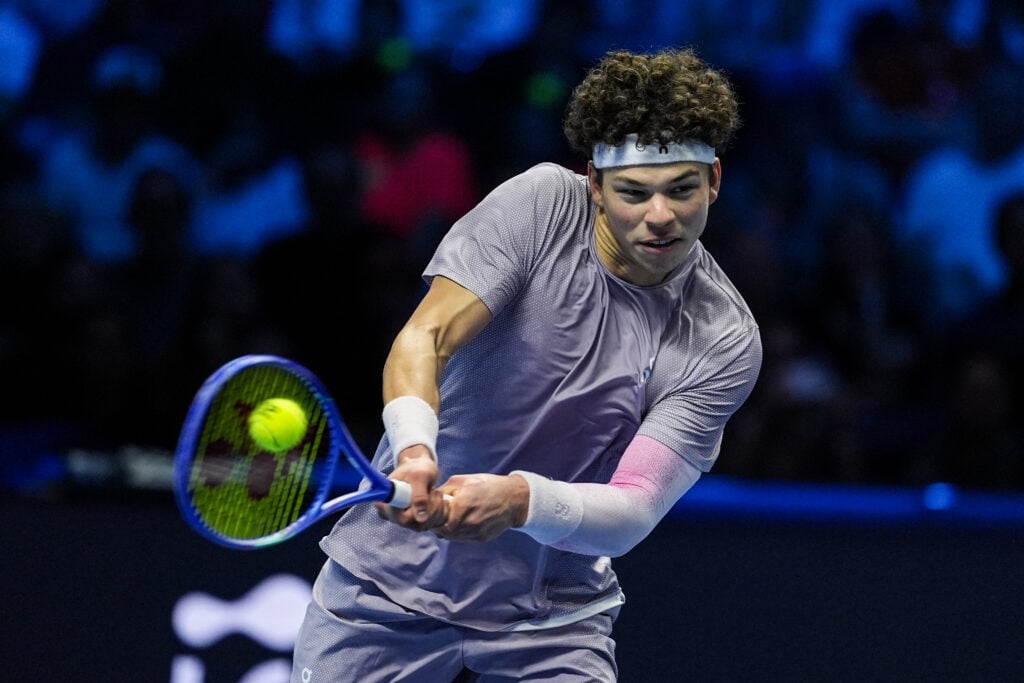 Ben Shelton of the United States returns a shot in the Men's Singles Group Stage match against Jannik Sinner of Italy during day six of the Nitto ATP Finals 2025 at Inalpi Arena on November 14, 2025 in Turin, Italy.