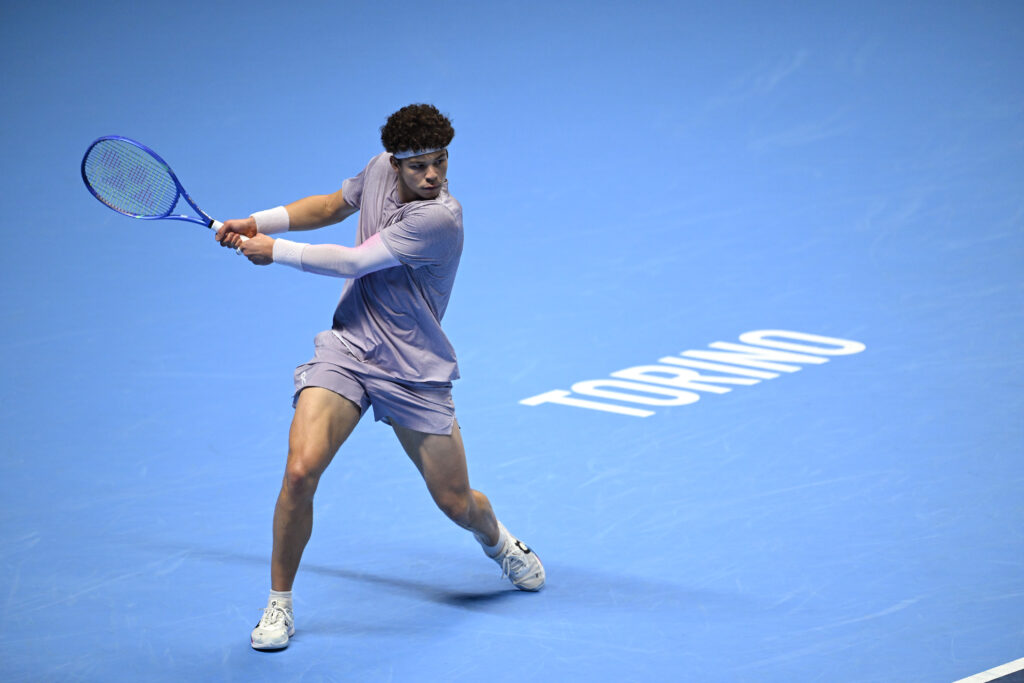 Ben Shelton of United States plays a backhand against Jannik Sinner of Italy during day six of the Nitto ATP Finals 2025 at Inalpi Arena on November 14, 2025 in Turin, Italy.