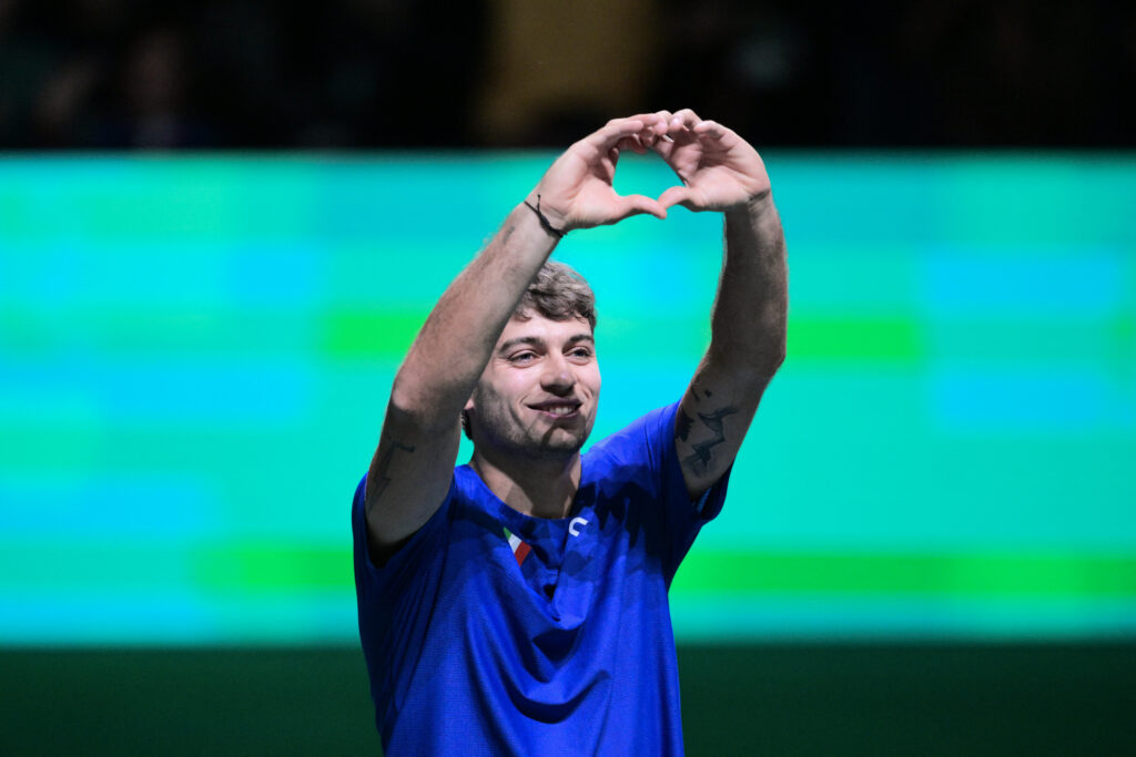 Italy's Flavio Cobolli reacts after winning against Austria's Filip Misolic during their Davis Cup men's singles quarter finals tennis match, at the Super Tennis Arena, in Bologna, northen Italy.