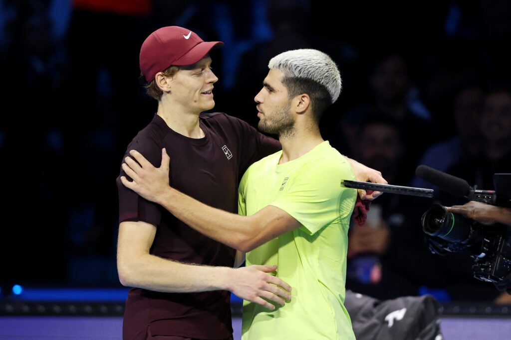 Jannik Sinner of Italy hugs Carlos Alcaraz of Spain following the Men's Singles Final on day eight of the Nitto ATP Finals 2025 at Inalpi Arena on November 16, 2025 in Turin, Italy.