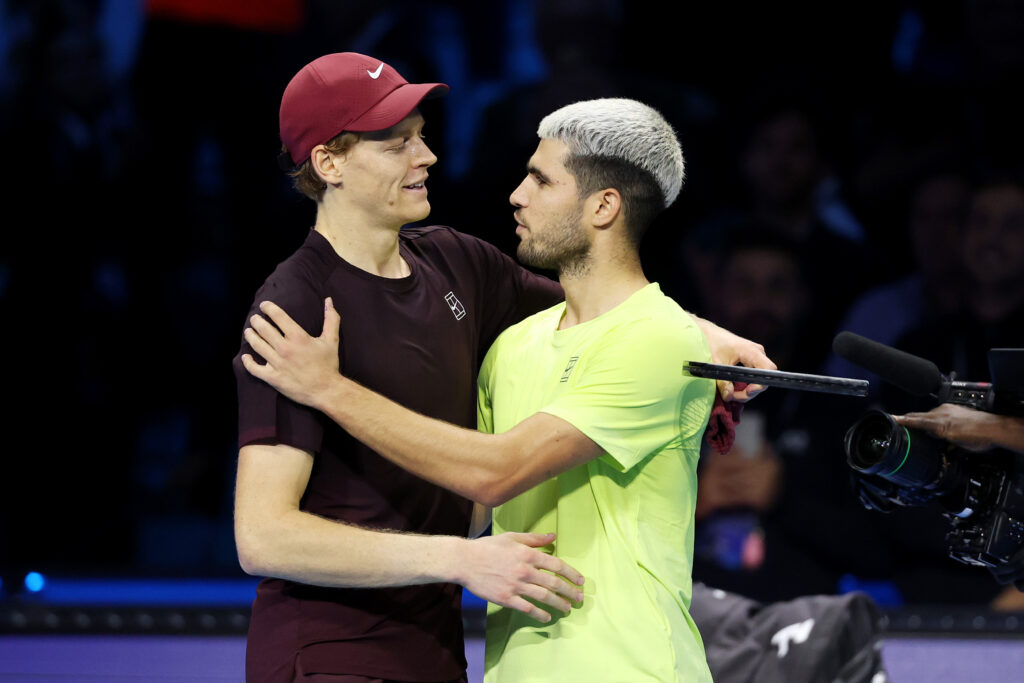 Jannik Sinner of Italy hugs Carlos Alcaraz of Spain following the Men's Singles Final on day eight of the Nitto ATP Finals 2025 at Inalpi Arena on November 16, 2025.