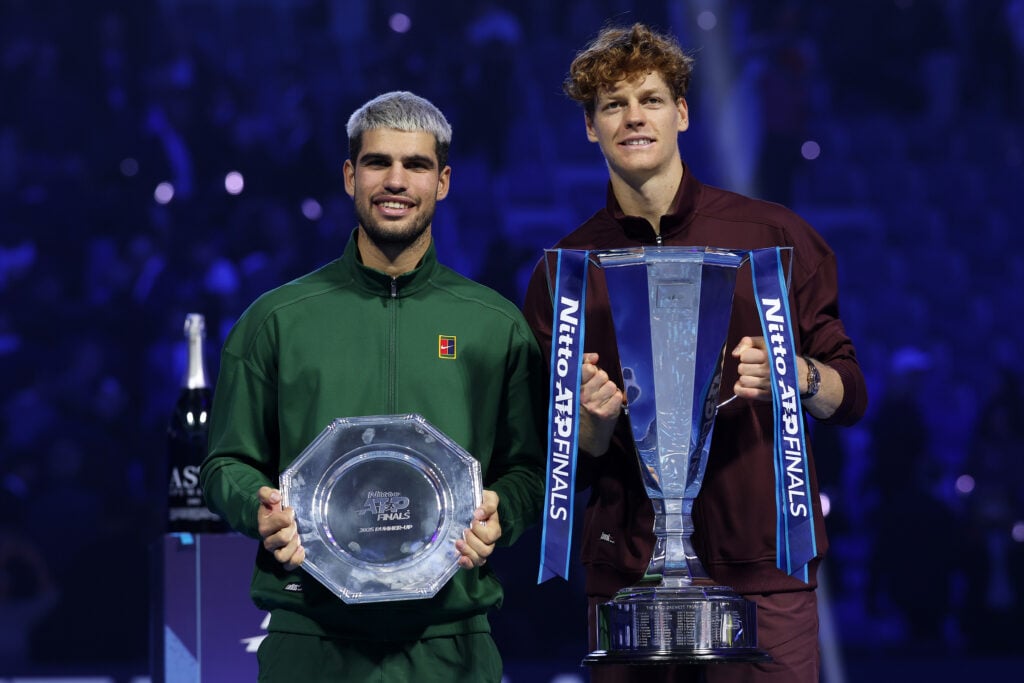 Winner Jannik Sinner of Italy poses for a photo with runner up Carlos Alcaraz of Spain following the Men's Singles Final on day eight of the Nitto ATP Finals 2025 at Inalpi Arena on November 16, 2025 in Turin, Italy.