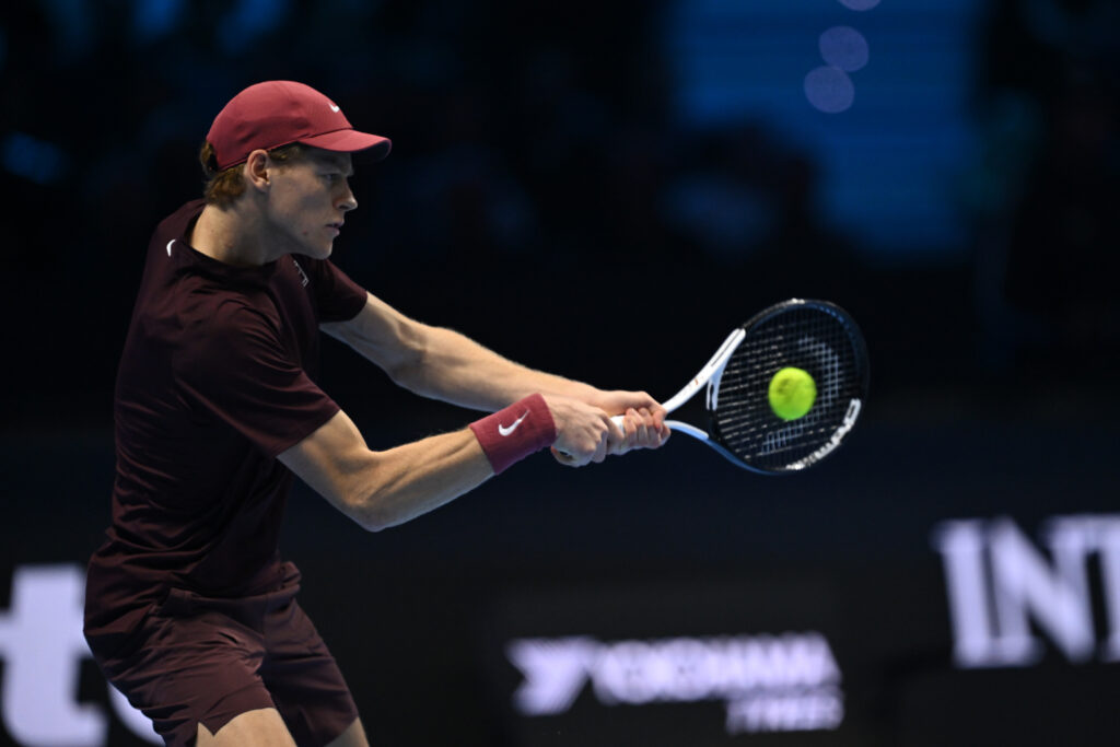 Jannik Sinner of Italy plays a backhand against Carlos Alcaraz of Spain during the Men's Singles Final on day eight of the Nitto ATP Finals 2025 at Inalpi Arena on November 16, 2025 in Turin, Italy.