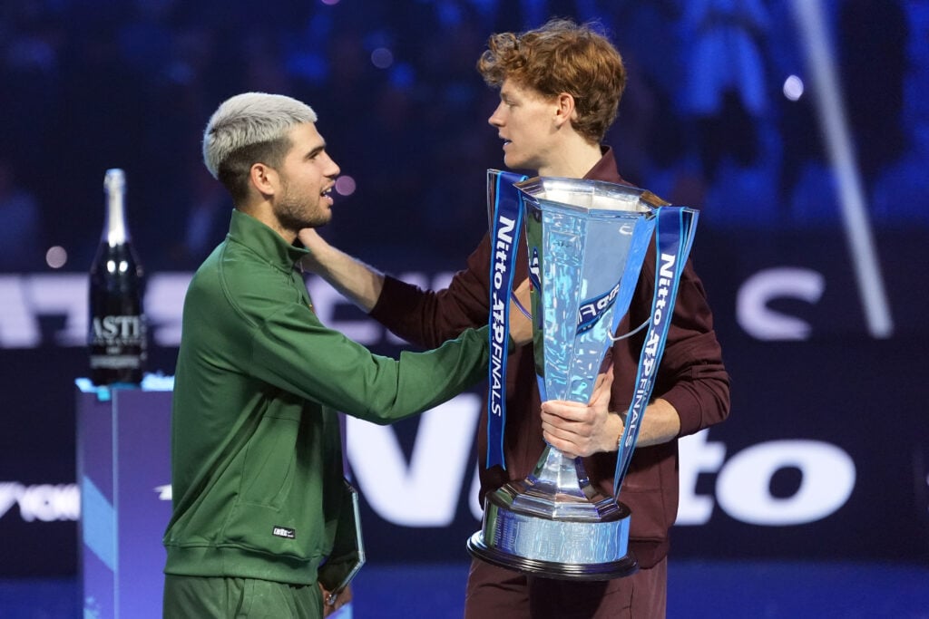 Jannik Sinner of Italy and Carlos Alcaraz of Spain looks with the trophy during day eight of the Nitto ATP Finals 2025 at Inalpi Arena on November 16, 2025 in Turin, Italy.