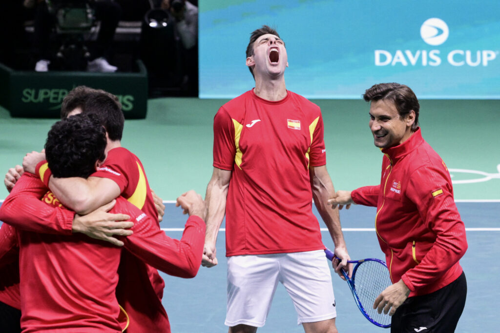 Spain's Pedro Martinez Portero (C) celebrates Spain's victory next to teammates and Spain's captain David Ferrer (R) at the end of the 2025 Davis Cup semi-final doubles tennis match against Germany at the Super Tennis Arena in Bologn.