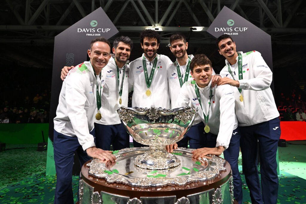 (L-R) Italy team captain Filippo Volandri, Simone Bolelli, Matteo Berrettini, Andrea Vavassori, Flavio Cobolli and Lorenzo Sonego pode for a photo with the trophy after victory in the Davis Cup Final match.