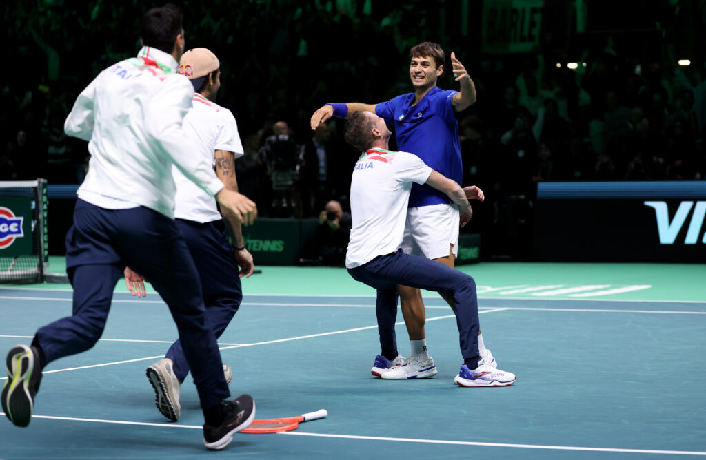Flavio Cobolli of Italy celebrates victory over Jaume Munar of Spain with captain Filippo Volandri following the Davis Cup Final match between Italy and Spain.