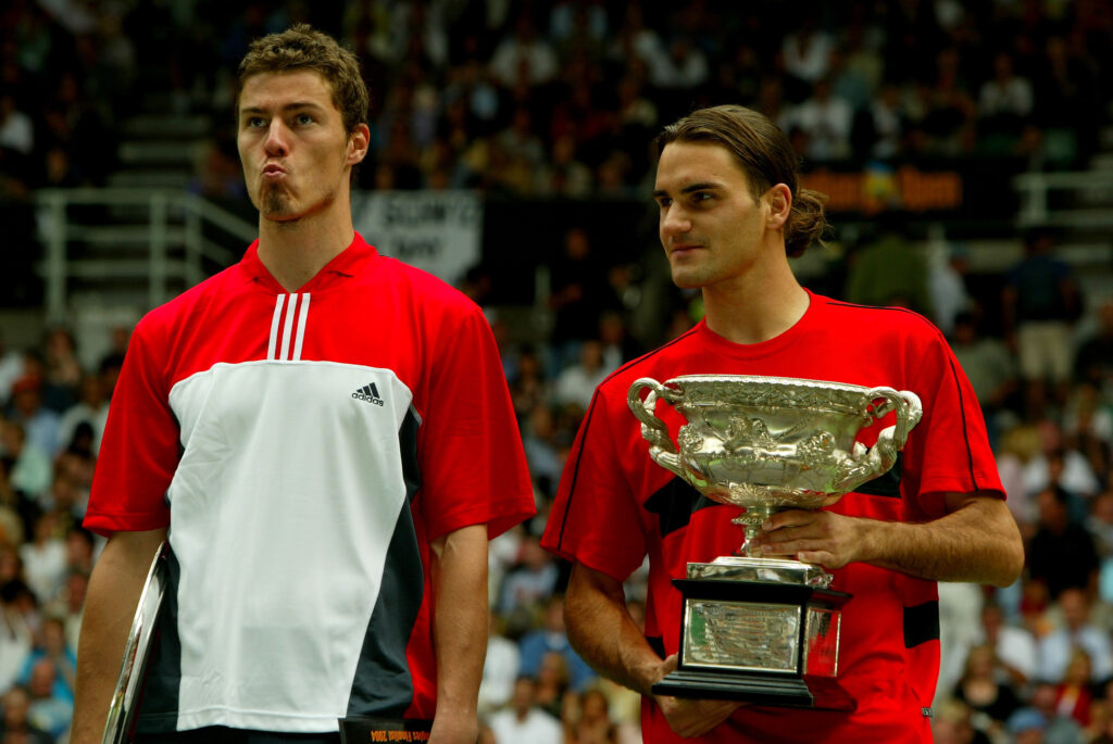 Marat Safin of Russia poses with Roger Federer of Switzerland after the Mens Singles Final during day fourteen of the Australian Open Grand Slam at Melbourne Park February 1, 2004 in Melbourne, Australia.