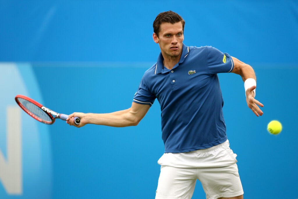Tobias Kamke of Germany in action against David Goffin of Belgium during their Men's Singles third round qualifying match on day two of the Aegon International at Devonshire Park on June 15, 2014 in Eastbourne, England.