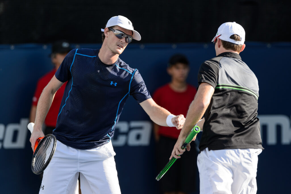 Jamie Murray of Great Britain encourages teammate John Peers of Australia during their doubles match against Leander Paes of India and Andy Murray of Great Britain on day four of the Rogers Cup at Uniprix Stadium on August 13, 2015 in Montreal, Quebec, Canada.