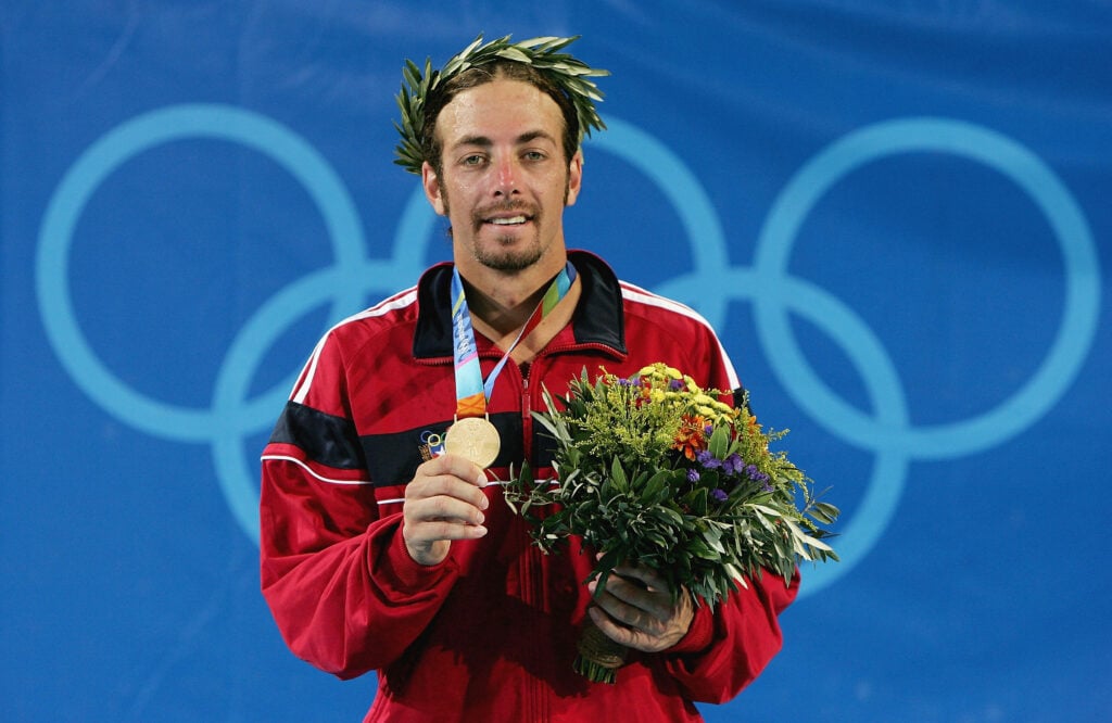 Nicolas Massu of Chile wins the gold medal for the men's singles tennis event on August 22, 2004 during the Athens 2004 Summer Olympic Games at the Olympic Sports Complex Tennis Centre in Athens, Greece.