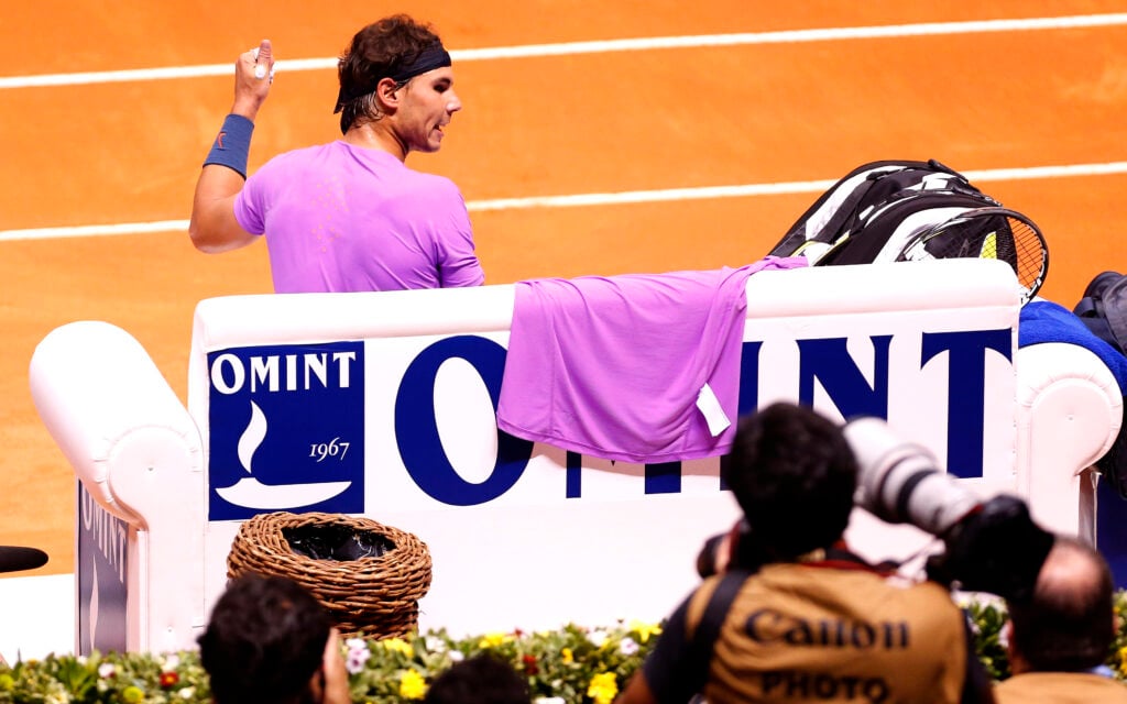Rafael Nadal of Spain complains to the umpire following his time violation at the Brasil Open, 2013