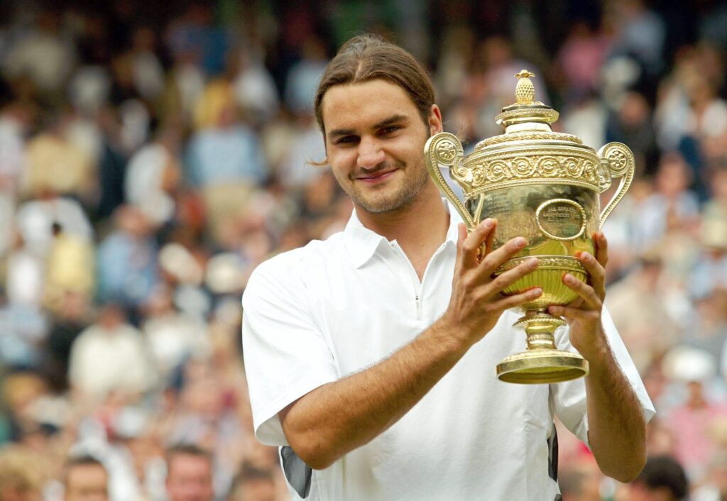 Roger Federer poses with the Wimbledon trophy in 2003.