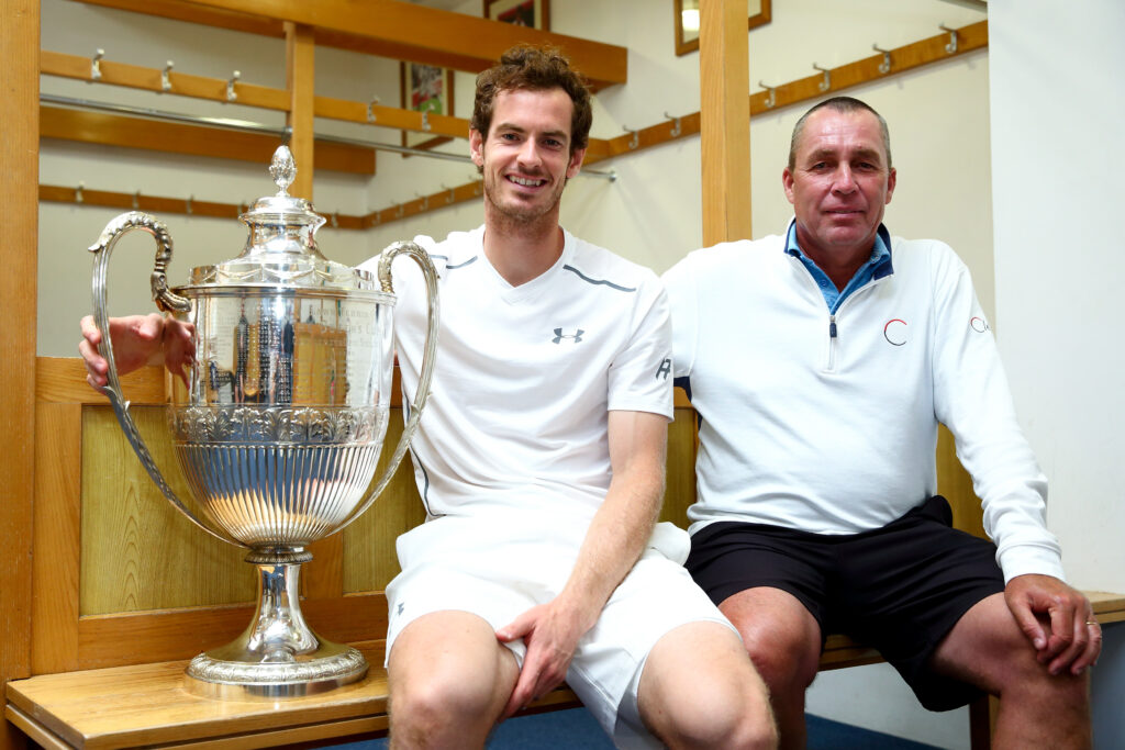 Andy Murray of Great Britain (L) and his coach Ivan Lendl (R) pose with the Aegon Championships trophy after winning his record breaking fifth title with victory in his final match against Milos Raonic of Canada during day seven of the Aegon Championships at the Queens Club on June 19, 2016 in London, England.