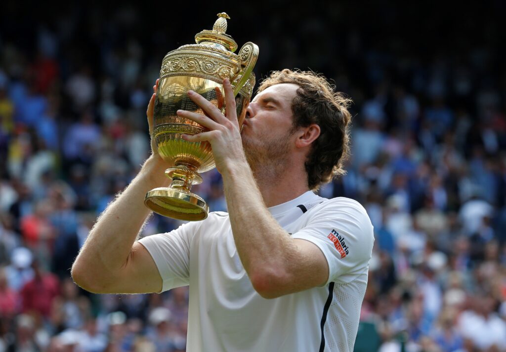 Andy Murray kisses the Wimbledon trophy