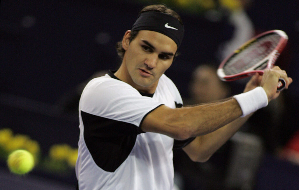 World number one Roger Federer of Switzerland, plays a shot during the finals match against David Nalbandian of Argentina at the 4.45 million USD Tennis Masters Cup tournament, held at the Qi Zhong Stadium, in Shanghai 20 November 2005. Federer won the first set 7-5.