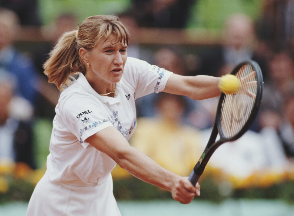 Steffi Graf from Germany plays a backhand return to Arantxa Sanchez Vicario of Spain during their Women's Singles Final match at the French Open Tennis Championship on 10th June 1989 at the Stade Roland Garros Stadium in Paris, France.