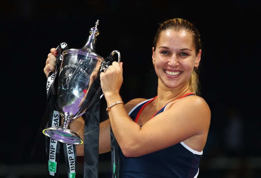 Dominika Cibulkova of Slovakia poses with the trophy after victory in her singles final against Angelique Kerber of Germany during day 8 of the BNP Paribas WTA Finals Singapore