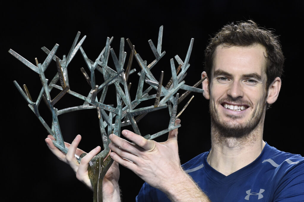 Britain's Andy Murray poses with his trophy on the podium after winning the final tennis match against USA's John Isner at the ATP World Tour Masters 1000 indoor tournament in Paris on November 6, 2016.