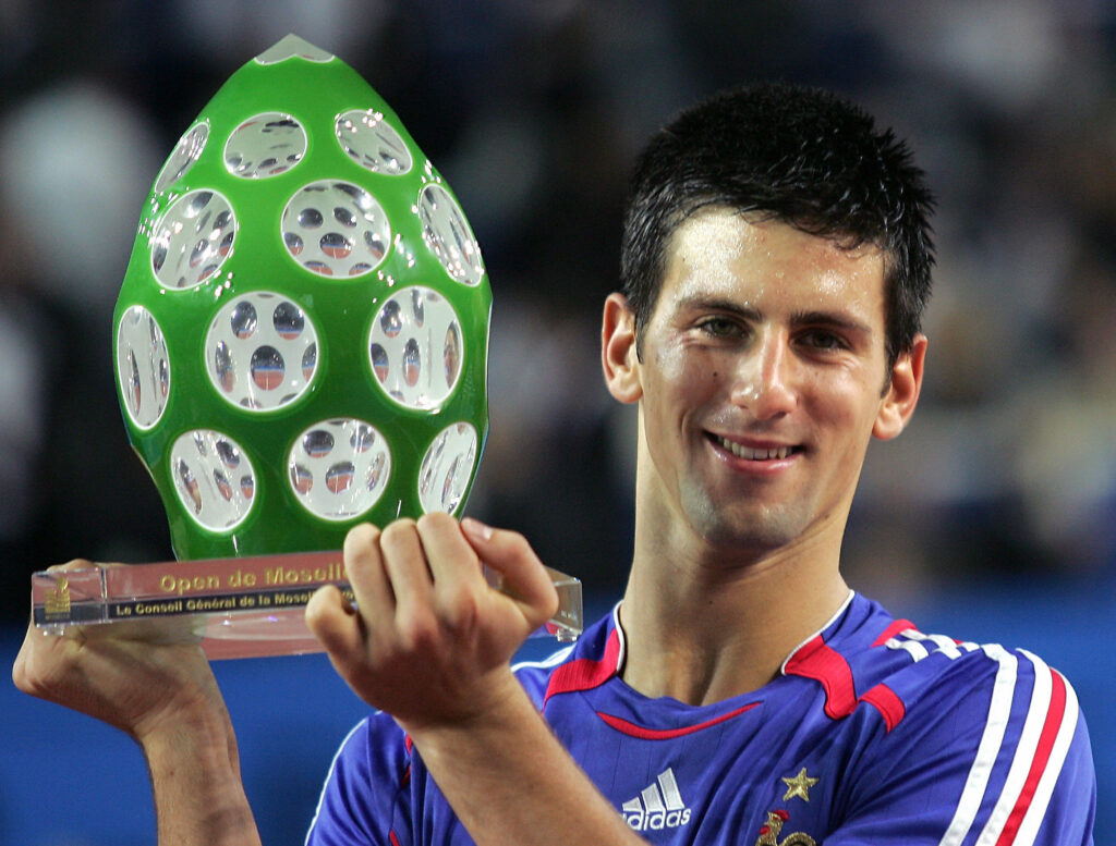 Novak Djokovic of Serbia holds the trophy after defeating Jurgen Melzer of Austria during the final of the Open de Moselle tournament, 08 October 2006 in Metz. Djokovic won 4-6, 6-3, 6-2