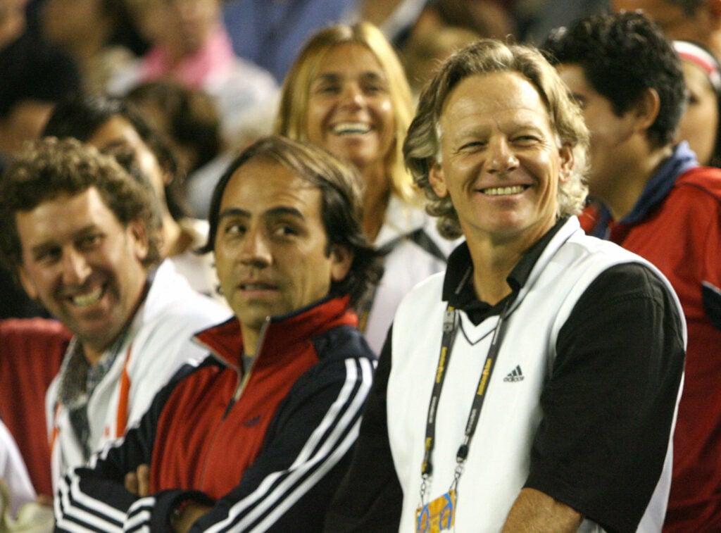 Tennis coach of Fernando Gonzalez of Chile Larry Stefanki (R) stands with others as they celebrate after the victory of Gonzalez in his semifinal men's singles match against Tommy Haas of Germany at the Australian Open tennis tournament in Melbourne, 26 January 2007. Gonzalez beat Haas 6-1, 6-3, 6-1.
