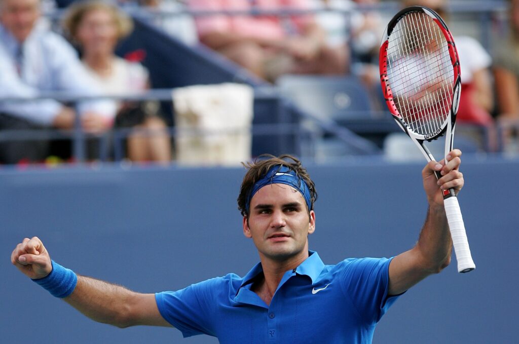 Roger Federer of Switzerland celebrates match point of his 7-5, 6-1, 7-5 win against Nikolay Davydenko of Russia during day thirteen of the 2007 U.S. Open.
