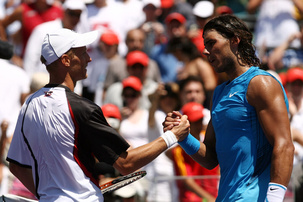 Nikolay Davydenko of Russia shakes hands with Rafael Nadal of Spain after defeating him to win the men's singles final on day fourteen of the Sony Ericsson Open.