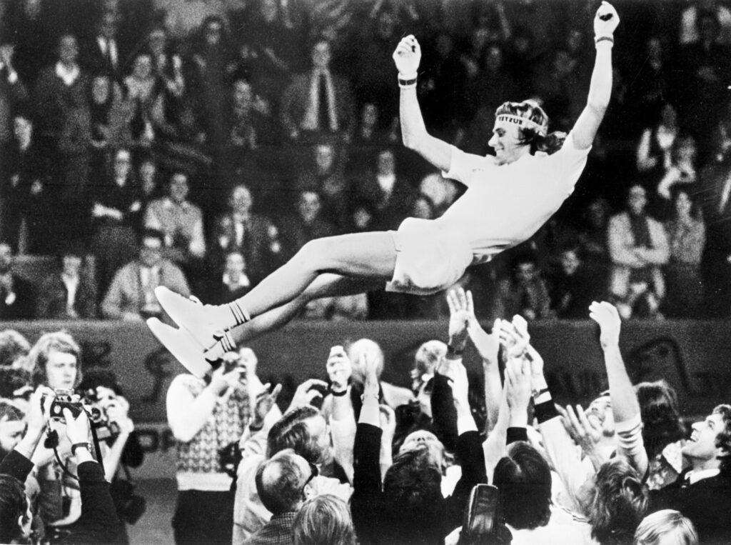 Tennis champion Bjorn Borg of Sweden is thrown up in the air by his teammates after winning his single match against Czech Jan Kodes (6-4 6-2 6-2) during the Davis Cup final in Stockholm on December 21, 1975.
