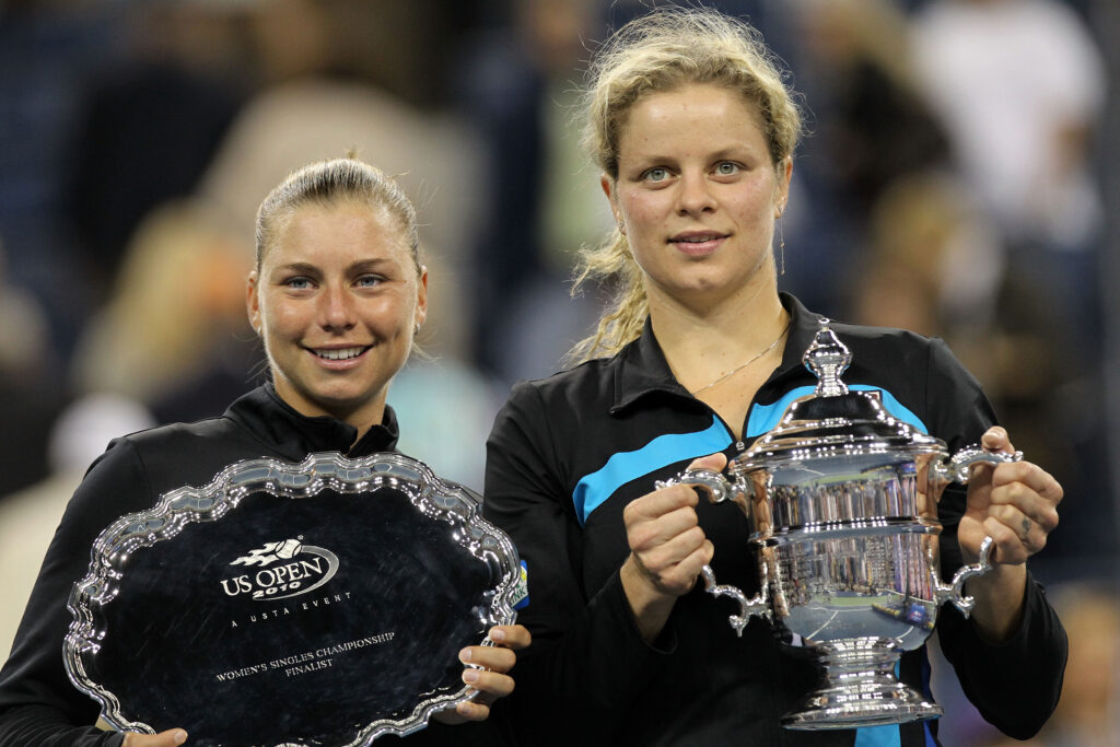 Kim Clijsters of Belguim (R) poses with the first place trophy alongside Vera Zvonareva of Russia (L) who poses with the second place trophy after their women's singles final on day thirteen of the 2010 U.S. Open at the USTA Billie Jean King National Tennis Center on September 11, 2010 in the Flushing neighborhood of the Queens borough of New York City.