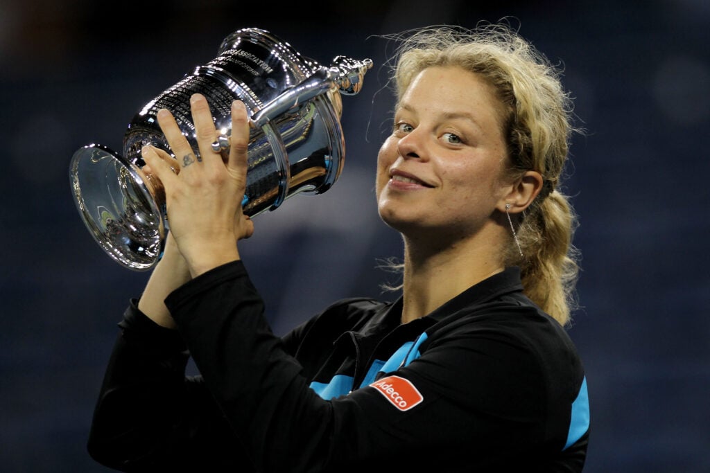 Kim Clijsters of Belguim kisses with the trophy in celebration of her win over Vera Zvonareva of Russia during their women's singles final on day thirteen of the 2010 U.S. Open at the USTA Billie Jean King National Tennis Center on September 11, 2010 in the Flushing neighborhood of the Queens borough of New York City.