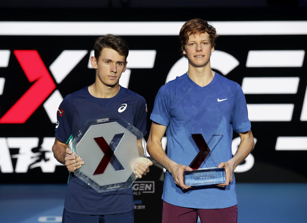 Jannik Sinner of Italy celebrates with the winners trophy next to runner up Alex de Minaur of Australia in the final during Day Five of the Next Gen ATP Finals