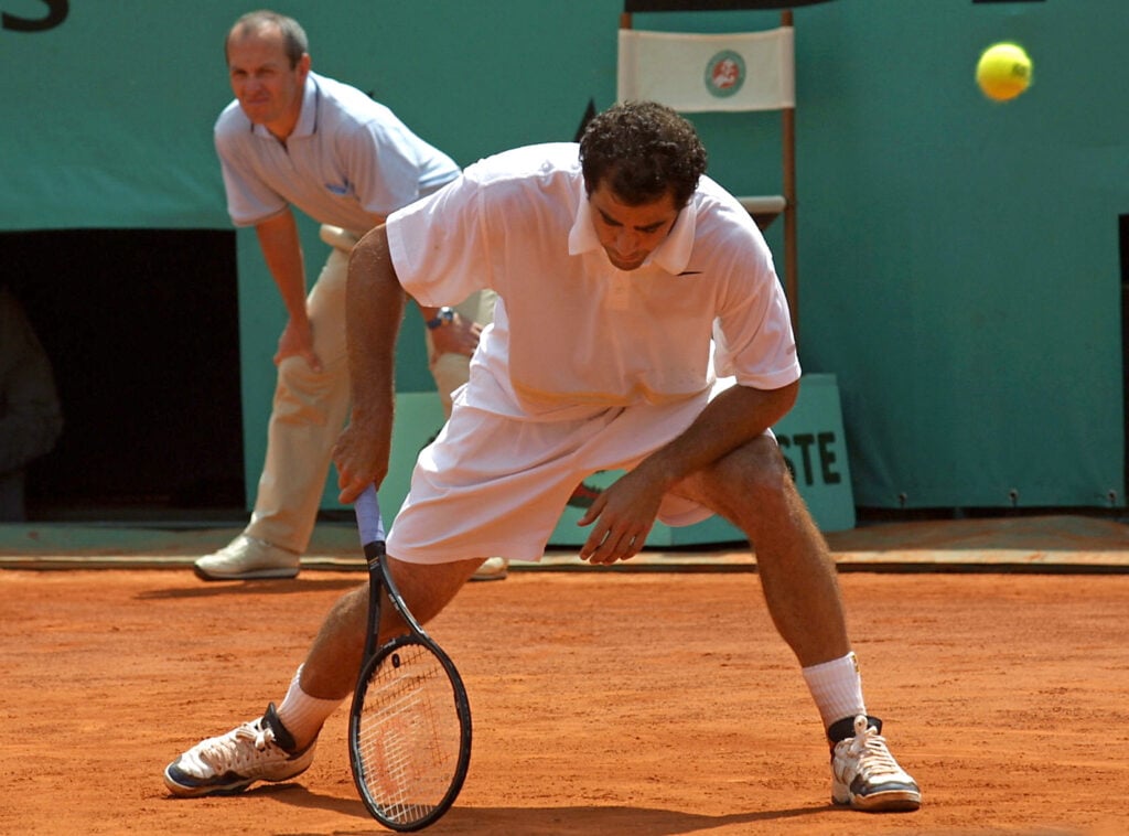US Pete Sampras tries to return a ball to Spanish Galo Blanco during their second round match 31 May 2001, at the French Tennis Open in Roland Garros, Paris. Blanco beat the US fifth seed 7-6 (7/4), 6-3, 6-2
