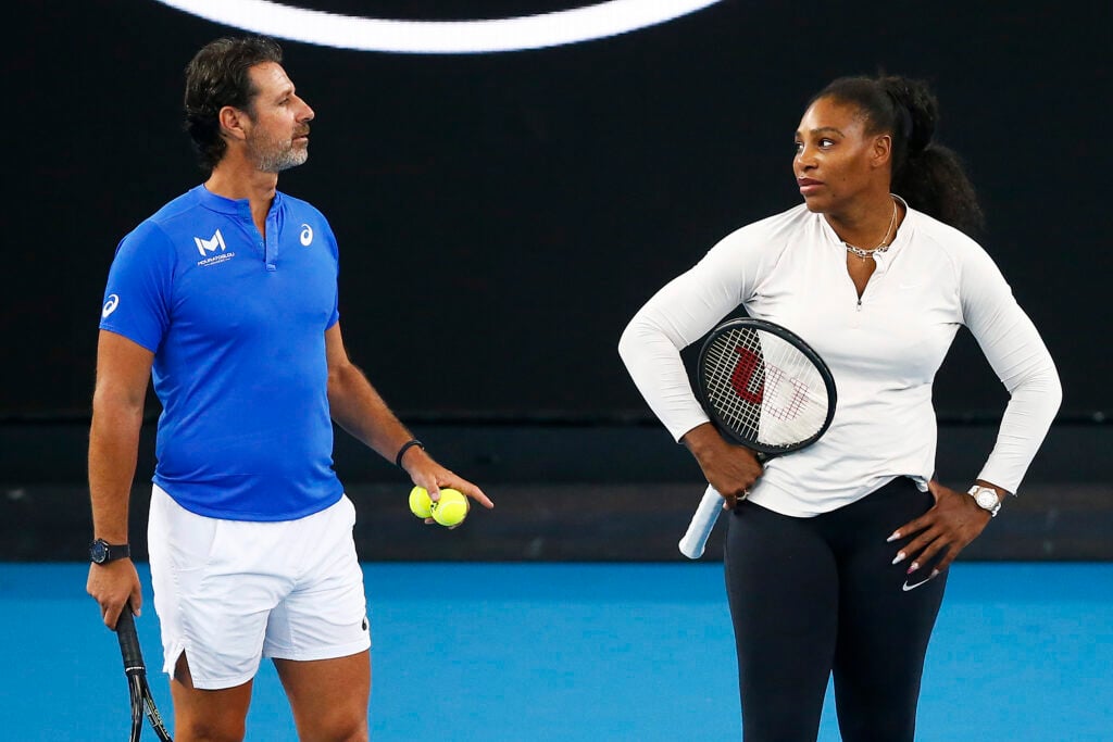 Serena Williams of United States (R) speaks with coach Patrick Mouratoglou during practice ahead of the 2020 Australian Open at Melbourne Park on January 17, 2020 in Melbourne, Australia.