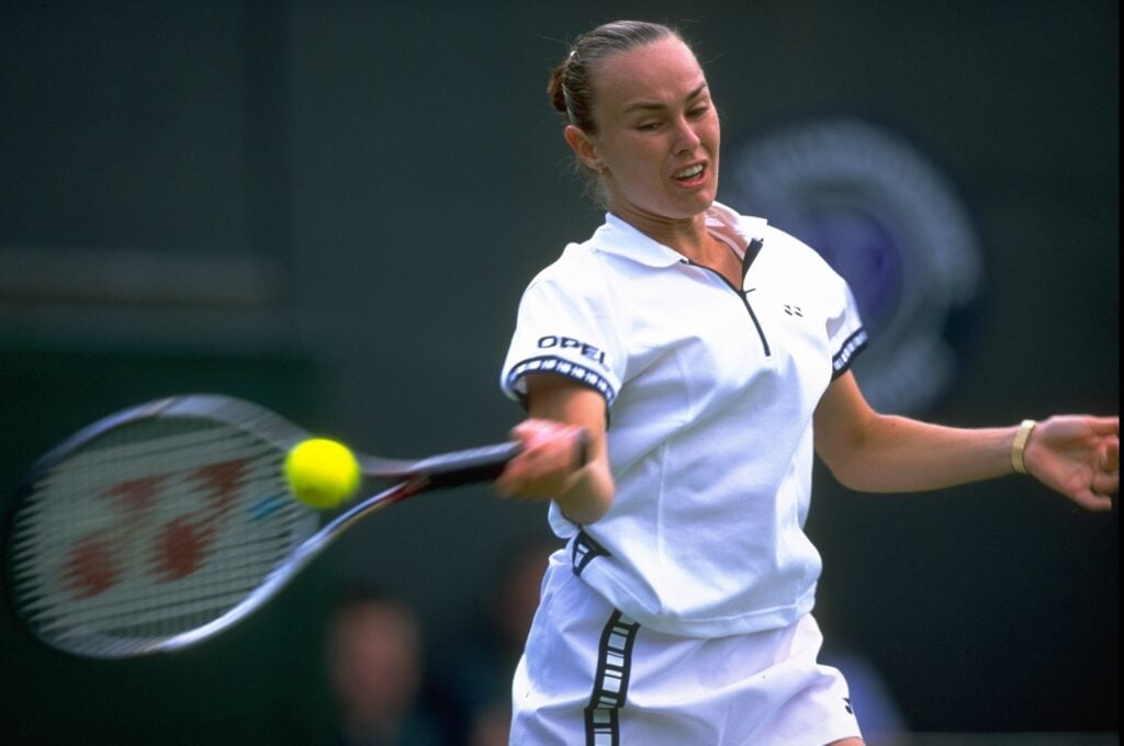Martina Hingis of Switzerland in action against Jelena Dokic of Australia in the first round match on the second day of the Championships played at the All England Club in London, England.