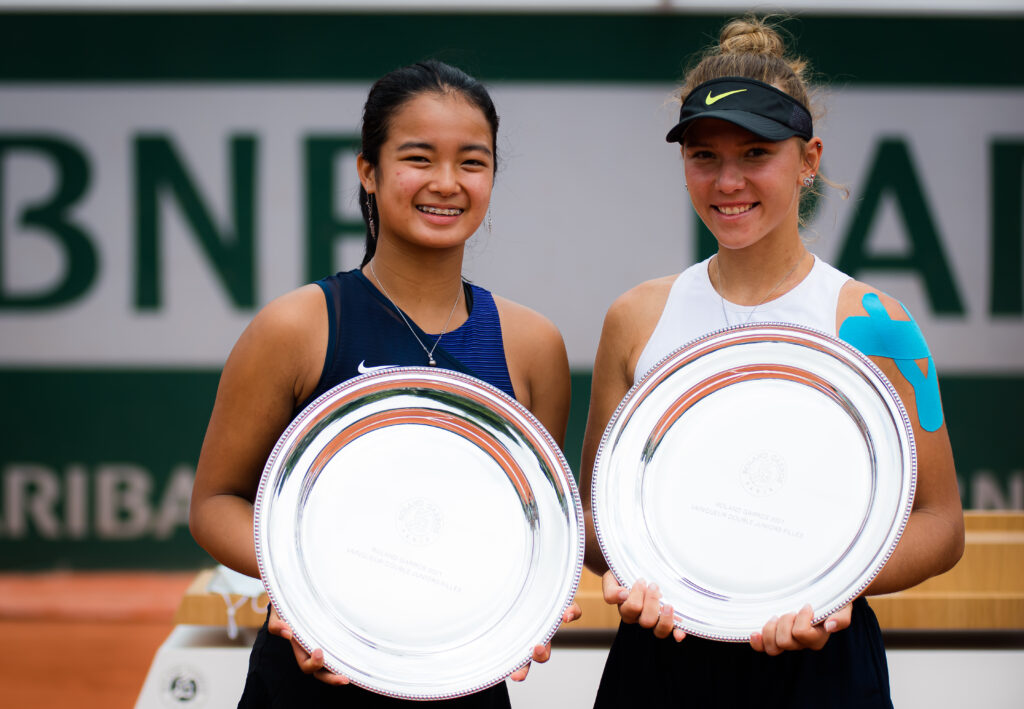Alexandra Eala of the Philippines and Oksana Selekhmeteva of Russia pose with their champions trophies after winning the Juniors doubles final of Roland Garros on June 12, 2021 in Paris, France