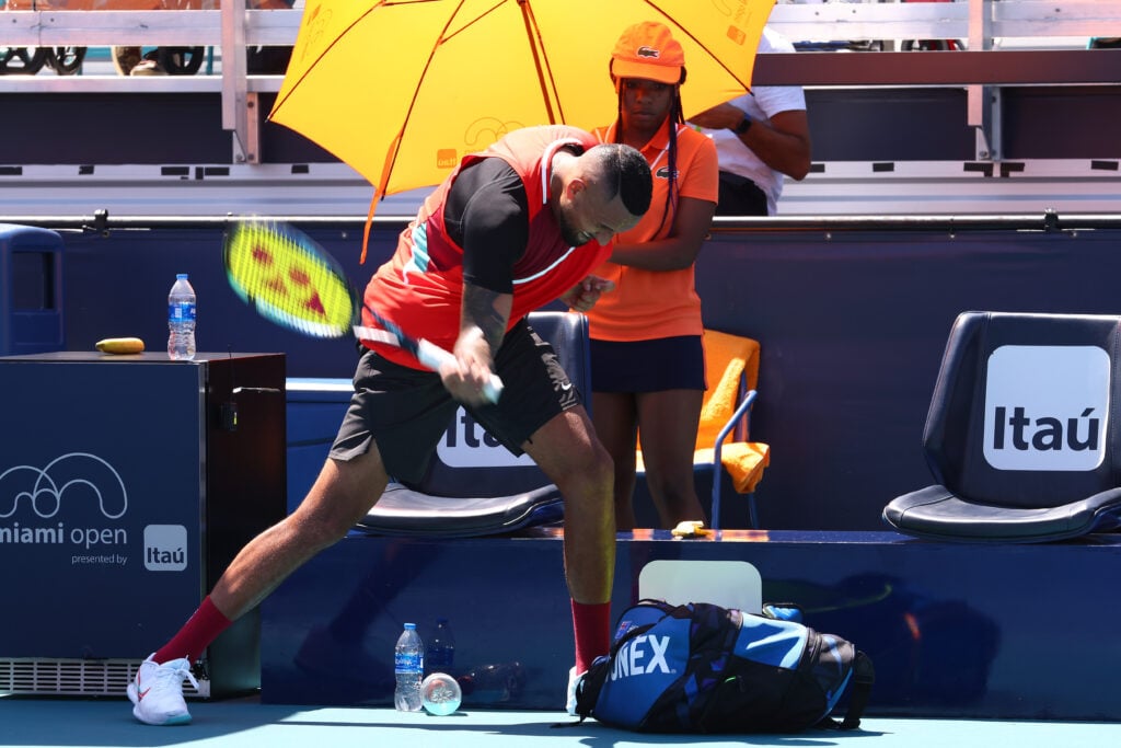 Nick Kyrgios smashes his racket