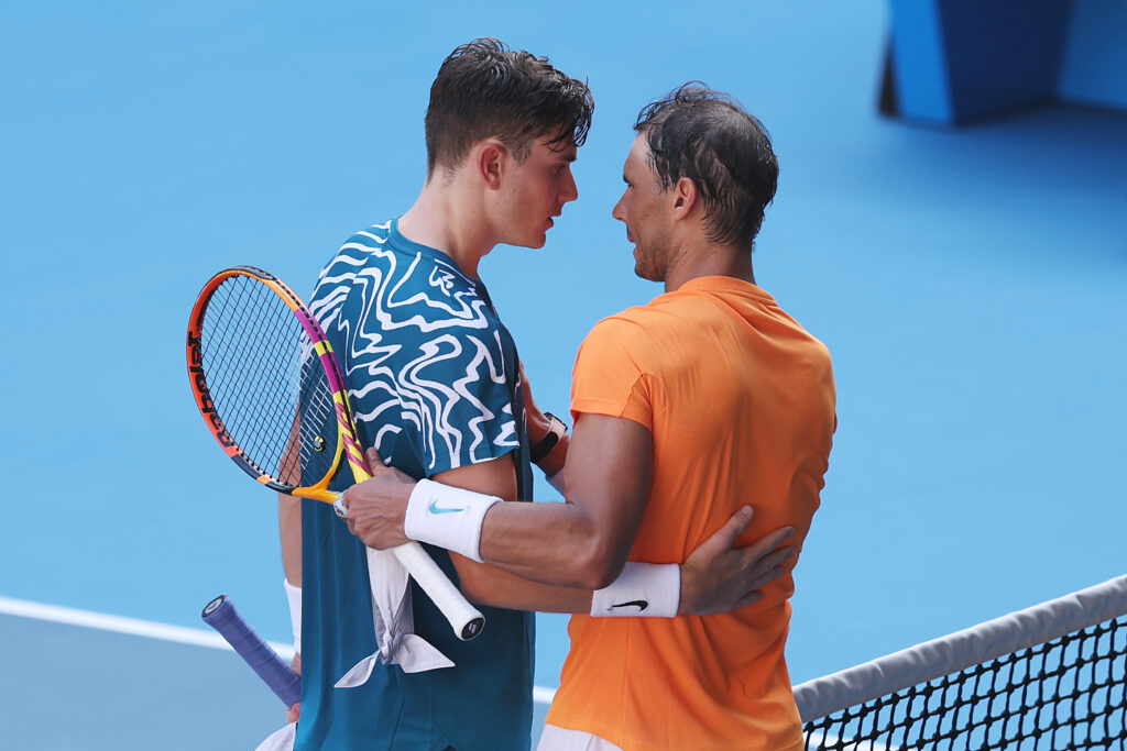 Rafael Nadal of Spain speaks to Jack Draper of Great Britain after winning their round one singles match during day one of the 2023 Australian Open