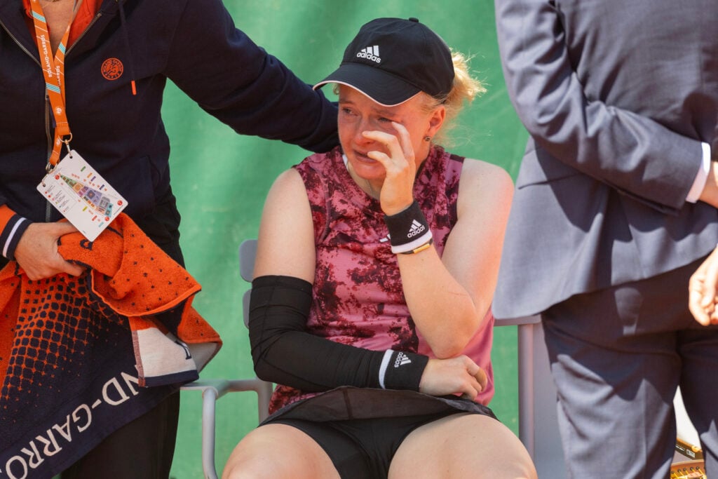 Francesca Jones of Great Britain in tears after retiring injured during her match against Elena I-Albon of Switzerland on Court Five during qualification round two at the 2023 French Open Tennis Tournament at Roland Garros on May 24, 2023, in Paris, France.