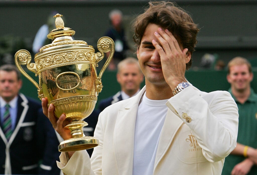 Switzerland's Roger Federer celebrates his fourth consecutive Wimbledon Championships title after beating Spain's Rafael Nadal at the Wimbledon Tennis Championships in Wimbledon, in south London, 09 July 2006.