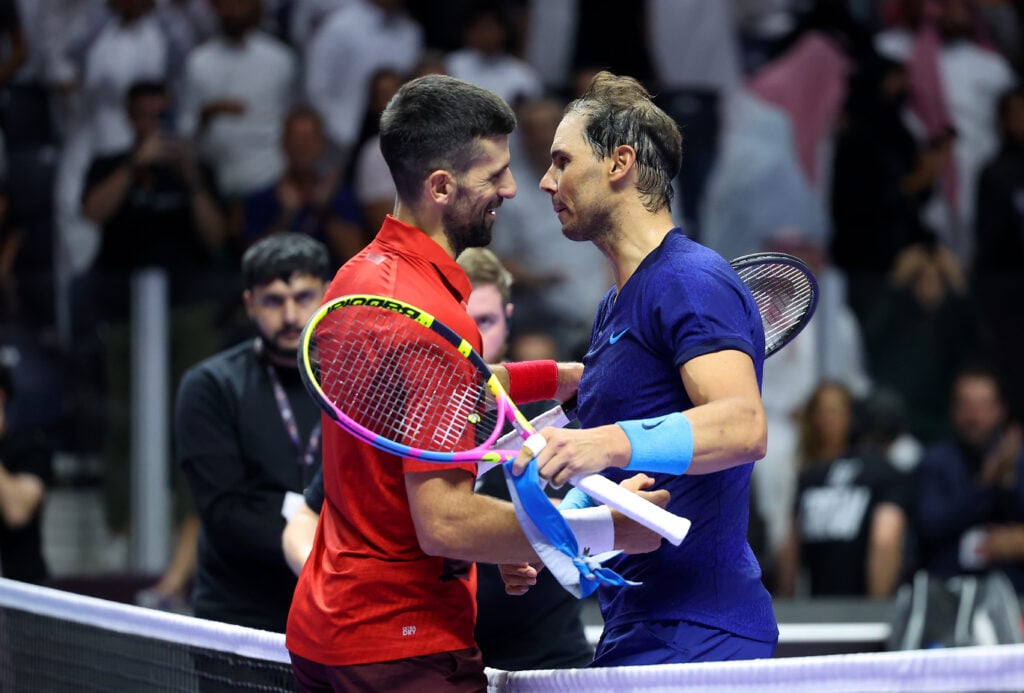 Novak Djokovic of Serbia (left) hugs Rafael Nadal of Spain after defeating him to win the Men's Singles Third Place Playoff match on day three of the Six Kings Slam 2024 at Kingdom Arena on October 19, 2024 in Riyadh, Saudi Arabia.