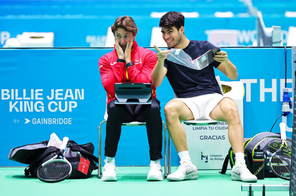 Juan Carlos Ferrero, coach of Team Spain speaks with Carlos Alcaraz of Team Spain during a practise session prior to the 2024 Davis Cup Finals at Palacio de Deportes Jose Maria Martin Carpena on November 17, 2024 in Malaga, Spain.