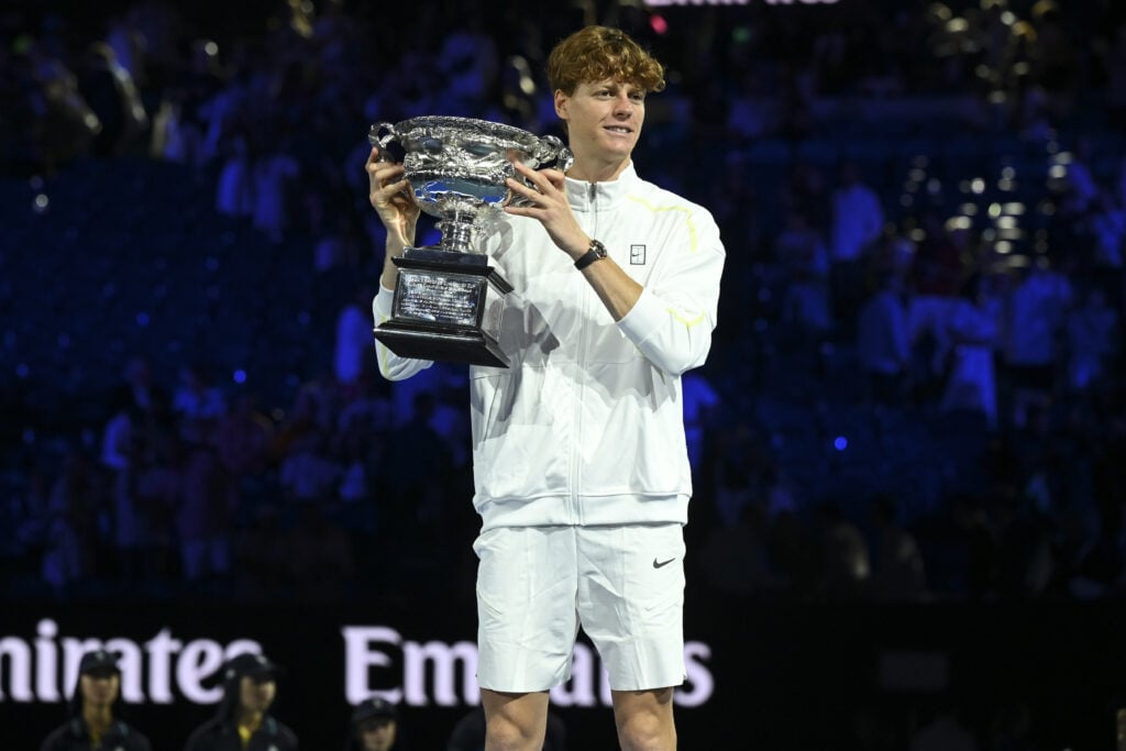 Jannik Sinner of Italy holds the Norman Brookes Challenge Cup after winning the Men's Singles Final against Alexander Zverev of Germany