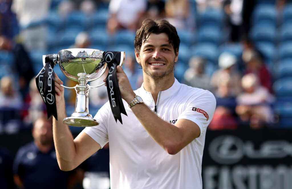Taylor Fritz of United States poses for a photo with the Lexus Eastbourne Open Men's Singles trophy following victory against Jenson Brooksby of United States in the Men's Singles Final on Day Six of the Lexus Eastbourne Open at Devonshire Park on June 28, 2025 in Eastbourne, England.