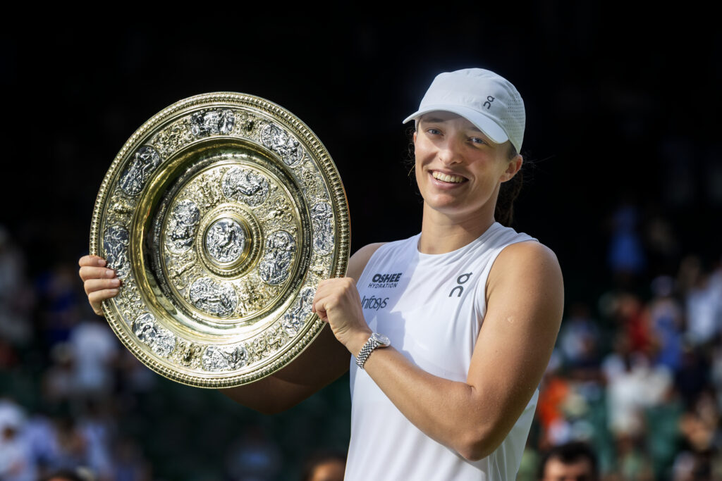 Iga Swiatek of Poland with the winners' trophy after her victory against Amanda Anisimova of the United States in the Women's Singles Final on Centre Court during the Wimbledon Lawn Tennis Championships at the All England Lawn Tennis and Croquet Club at Wimbledon on July 12th, 2025, in London, England.