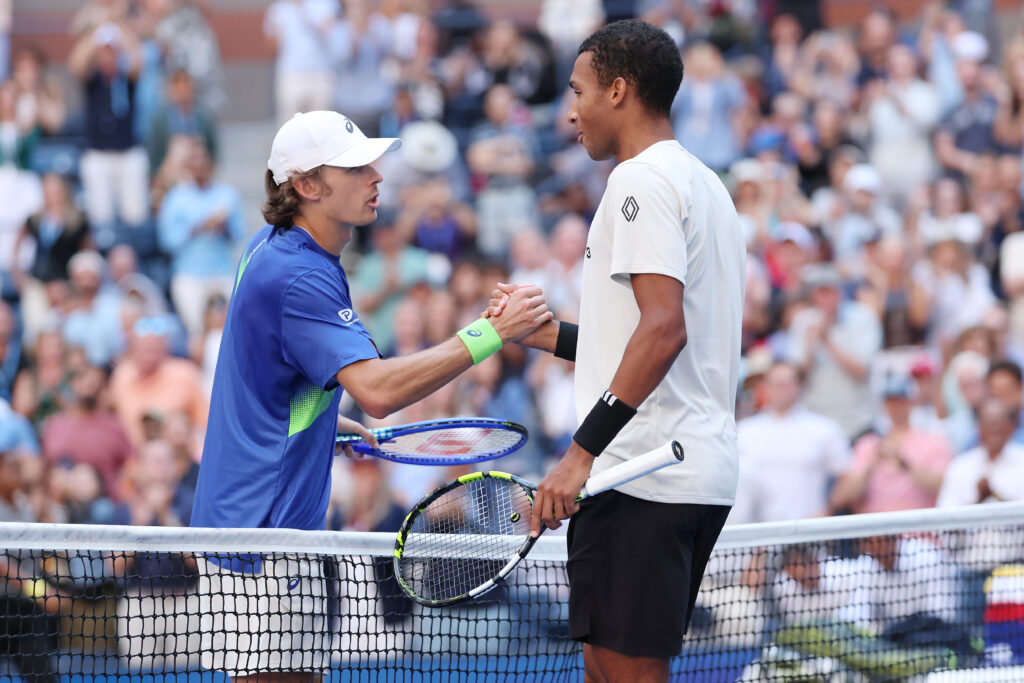 Felix Auger-Aliassime of Canada and Alex de Minaur of Australia shake hands at the net following their Men's Quarterfinal match on Day Eleven of the 2025 US Open at USTA Billie Jean King National Tennis Center on September 3, 2025 in the Flushing neighborhood of the Queens borough of New York City.